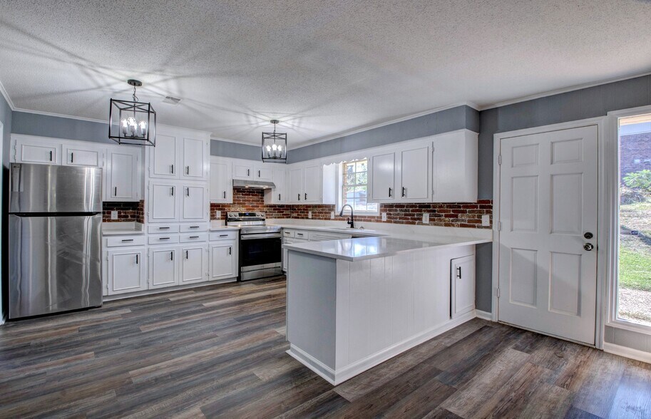 Kitchen - Stone Counter Top with Custom Brick Backsplash - 11315 Ethan Allen Dr