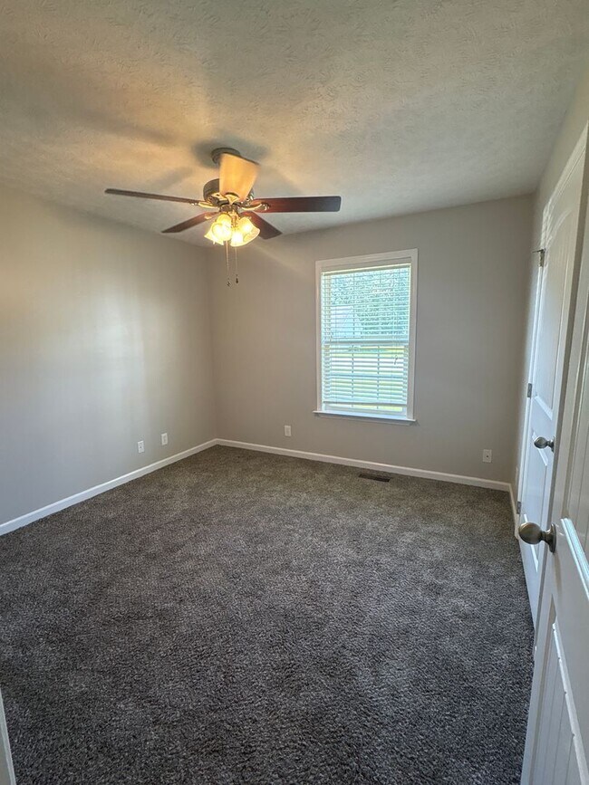 Building Photo - Charming Home with Covered Back Deck and Fenced in Yard...