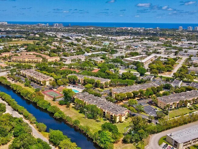 Building Photo - 5-Min Walk to FAU – Private Room in Furnished 2/2 Condo w/ Pool & Canal Views – $1550