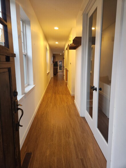 Bright hallway, office to your right with double French doors - 7727 N Kellogg St