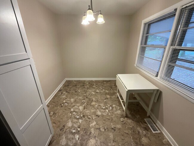 Building Photo - Reduced to $1550/mo! N Central Greensboro location, 3/2 brick home with lots of shade, fresh paint!