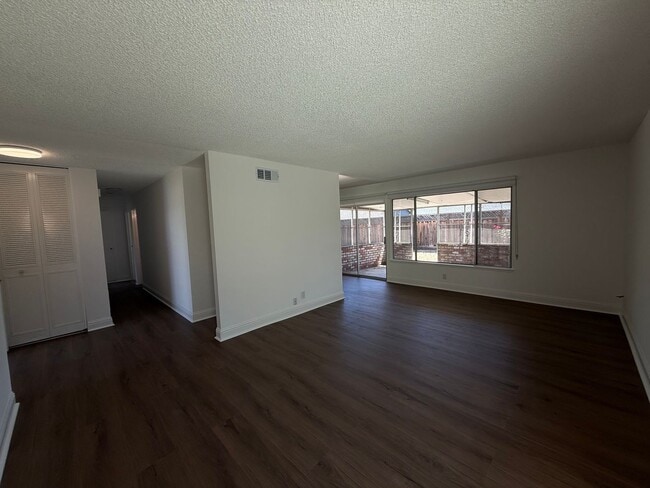 Building Photo - Recently updated home with new floors, paint & bathroom!