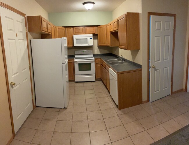 Kitchen featuring modern appliances including dishwasher - 401 Olmstead St