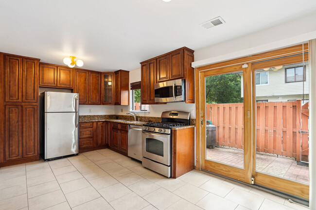 Cherry cabinetry & granite counters! - 8407 Alameda Ct