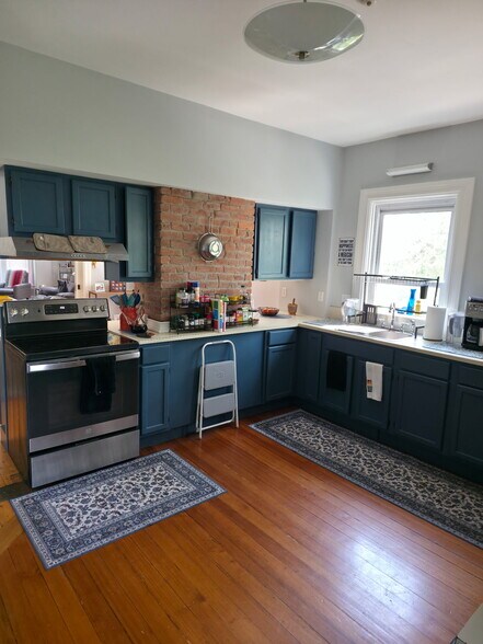 Kitchen stove and sink area - 86 Holden St