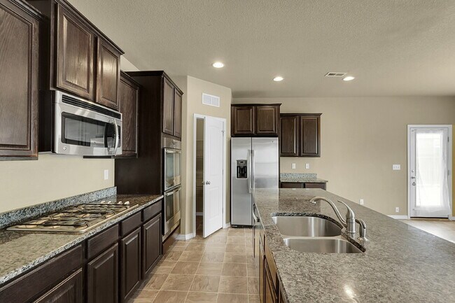 Building Photo - $2,490.95 - 4 Bed, 2.5 Bath Home in CO Springs with Fenced in Yard and 3 Car Garage!