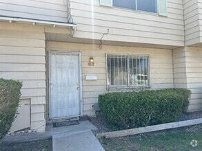 Building Photo - Three bedroom townhome with 2 car garage a...