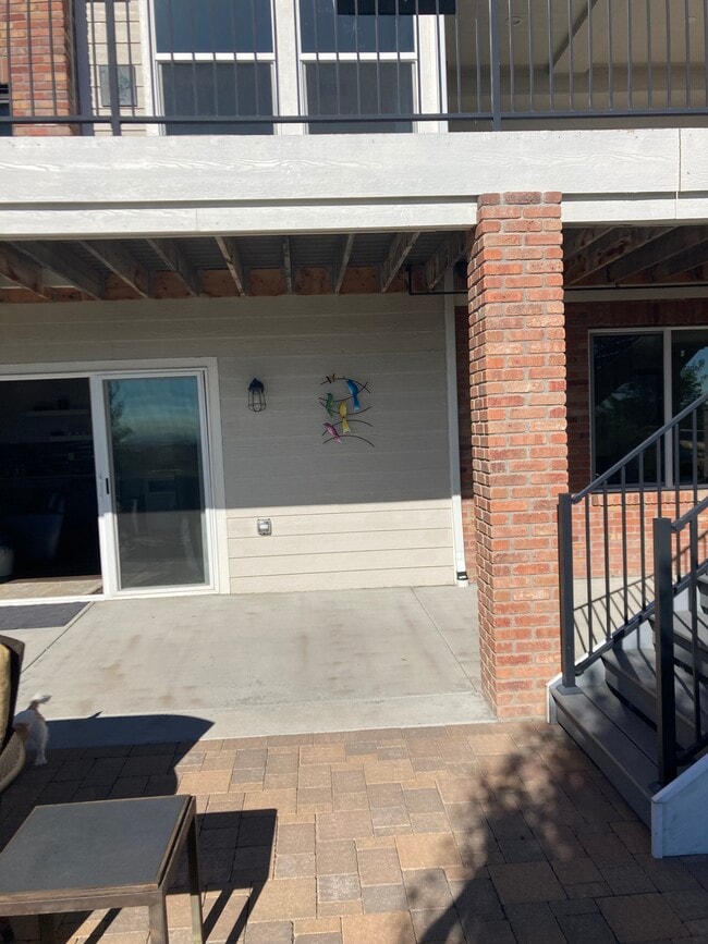 Covered patio in front of sliding doors - 6844 Carr St