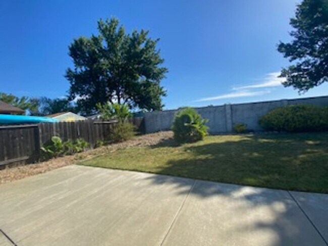 Building Photo - Huge semi-private Backyard with Large Patio!