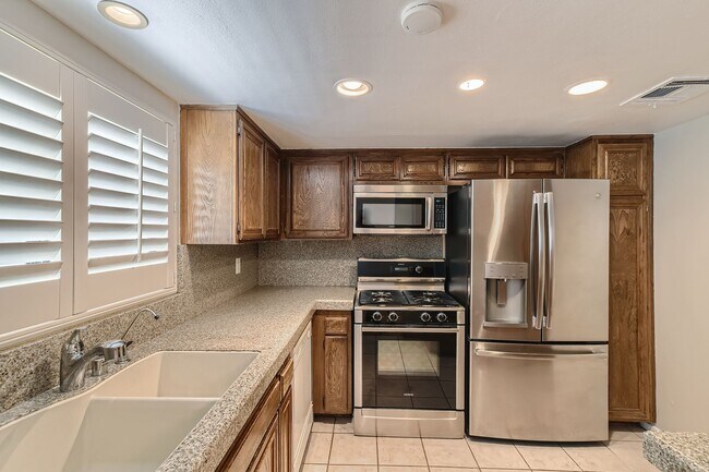 Building Photo - Freshly Updated 2-Bedroom Condo with Attached Garage in Gated Winnetka Community
