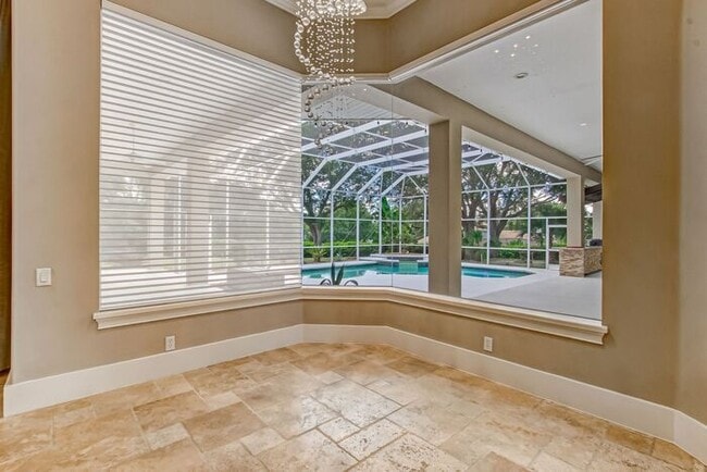 Building Photo - Stunning 5-Bedroom Pool Home on Nearly 2 A...