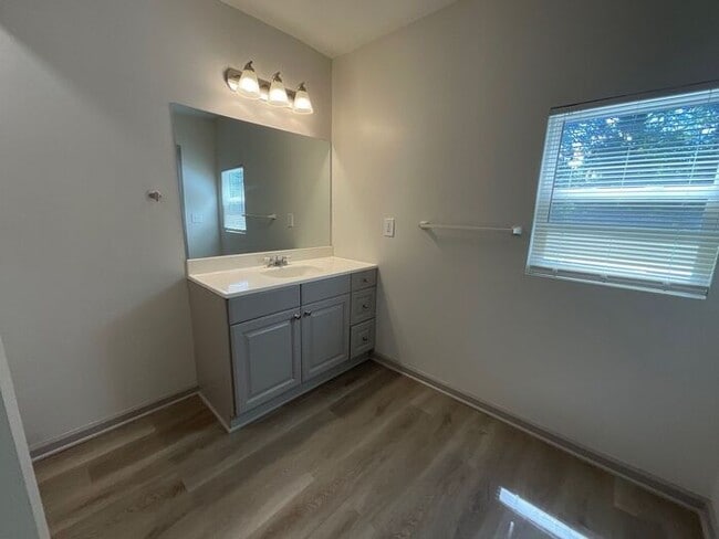 Building Photo - **Spacious 4BR with Modern Upgrades & Cove...