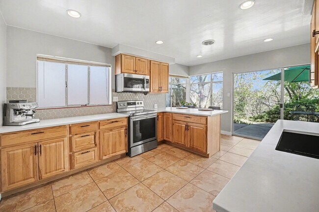 Building Photo - Sunlit Wheat Ridge Gem with Huge Wooded Backyard