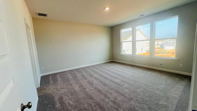 Building Photo - BRAND NEW & Beautiful Townhome with 2 car ...