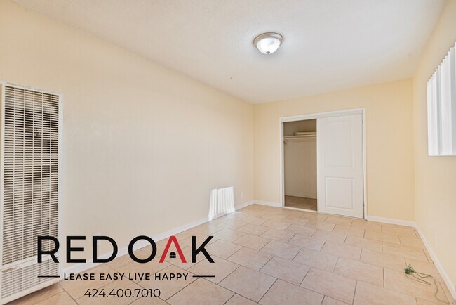 Building Photo - Spacious Two Bedroom with Tile Floors, Lar...