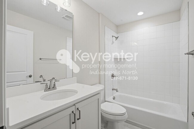 Building Photo - Located in Westfield, IN, this attractive 3-bedroom, 2.5-bath home sits on a corner lot within an...