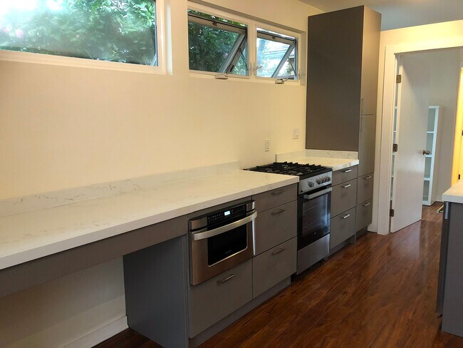 Generous quartz countertop space - 4360 Stewart Ave
