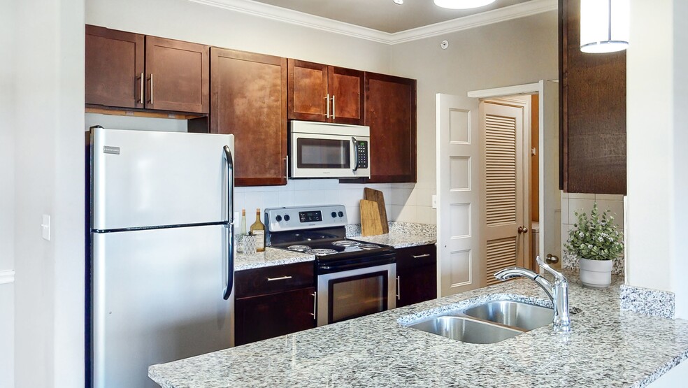 Modern Kitchen with Stainless Steel Appliances - The Shores Apartments