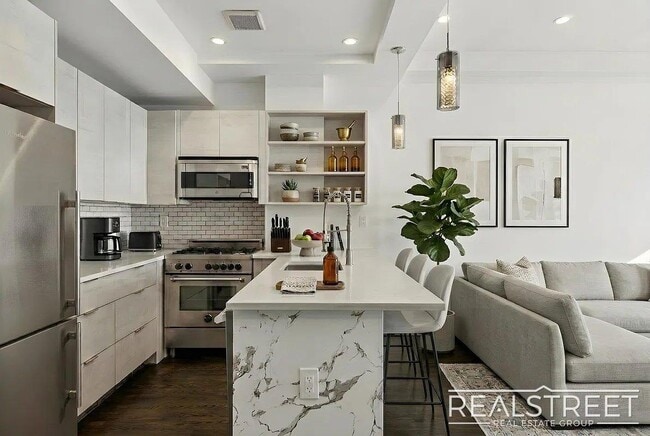 Building Photo - Modern Bushwick 2-bedroom, 2.5-bath duplex with private garden, deck, and finished recreation room —