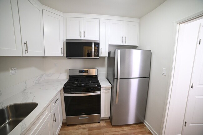 Building Photo - Newly remodeled studio in a gated building with pool and laundry room!