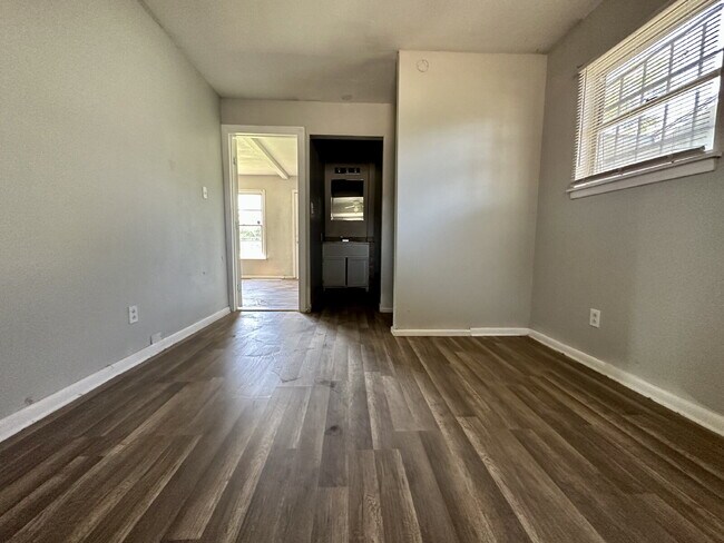 Building Photo - Updated Home with Gorgeous Floors & Large Backyard