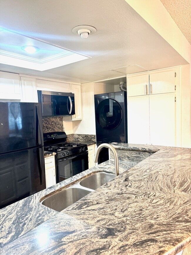 new microwave - 8463 De Soto Ave