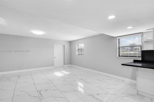 Building Photo - 5061 W 12th Ln