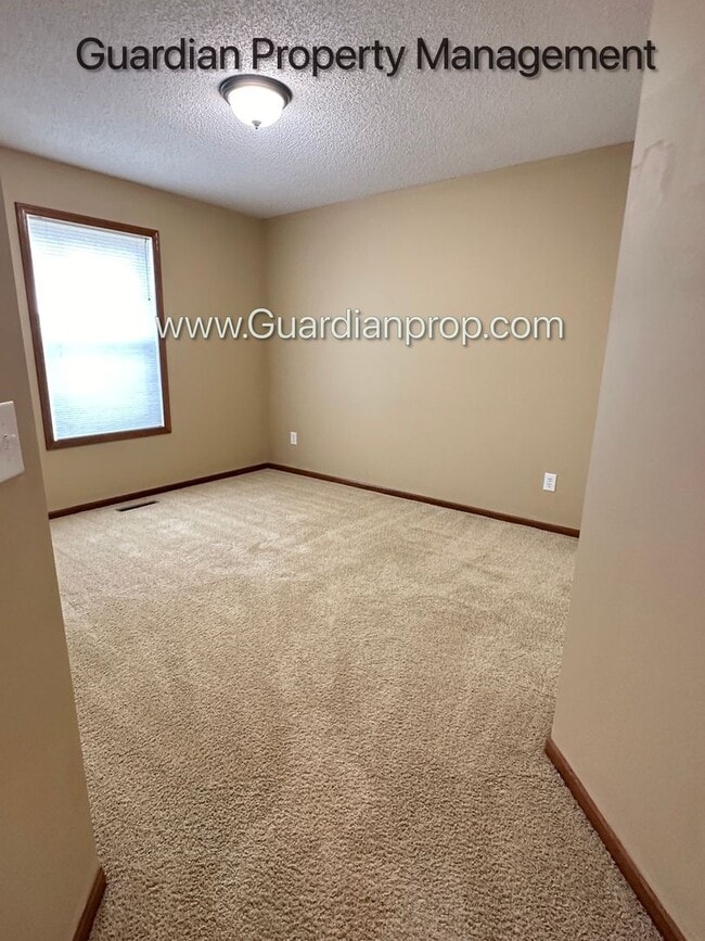 Building Photo - Pet Free Champlin Town Home, 3.5 Baths, 2 Car Garage, Dishwasher, Balcony, Available end of April