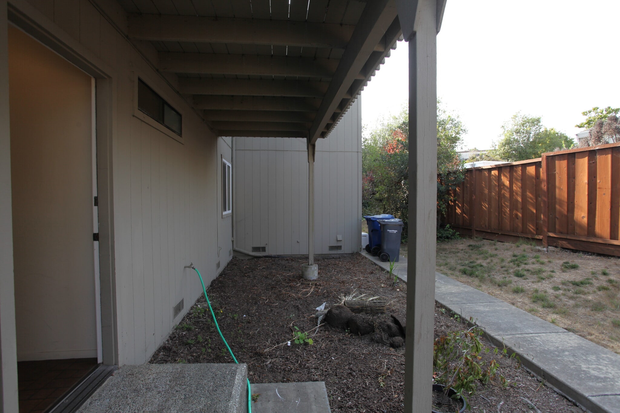 This area is fenced and is accessible through side door. Perfect for a dog to hang out. - 1968 Dolphin Dr