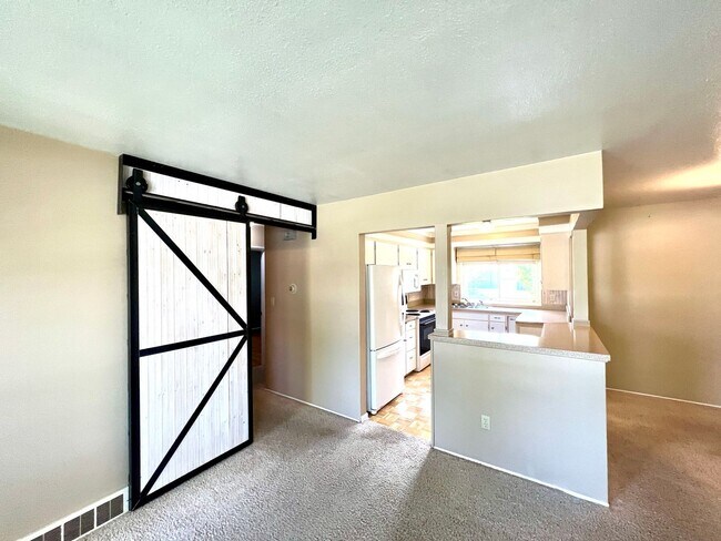 Building Photo - 4 bed 2 bath Single Family Home with Bonus Room, Fully Fenced Yard and Double Car Garage Close to...