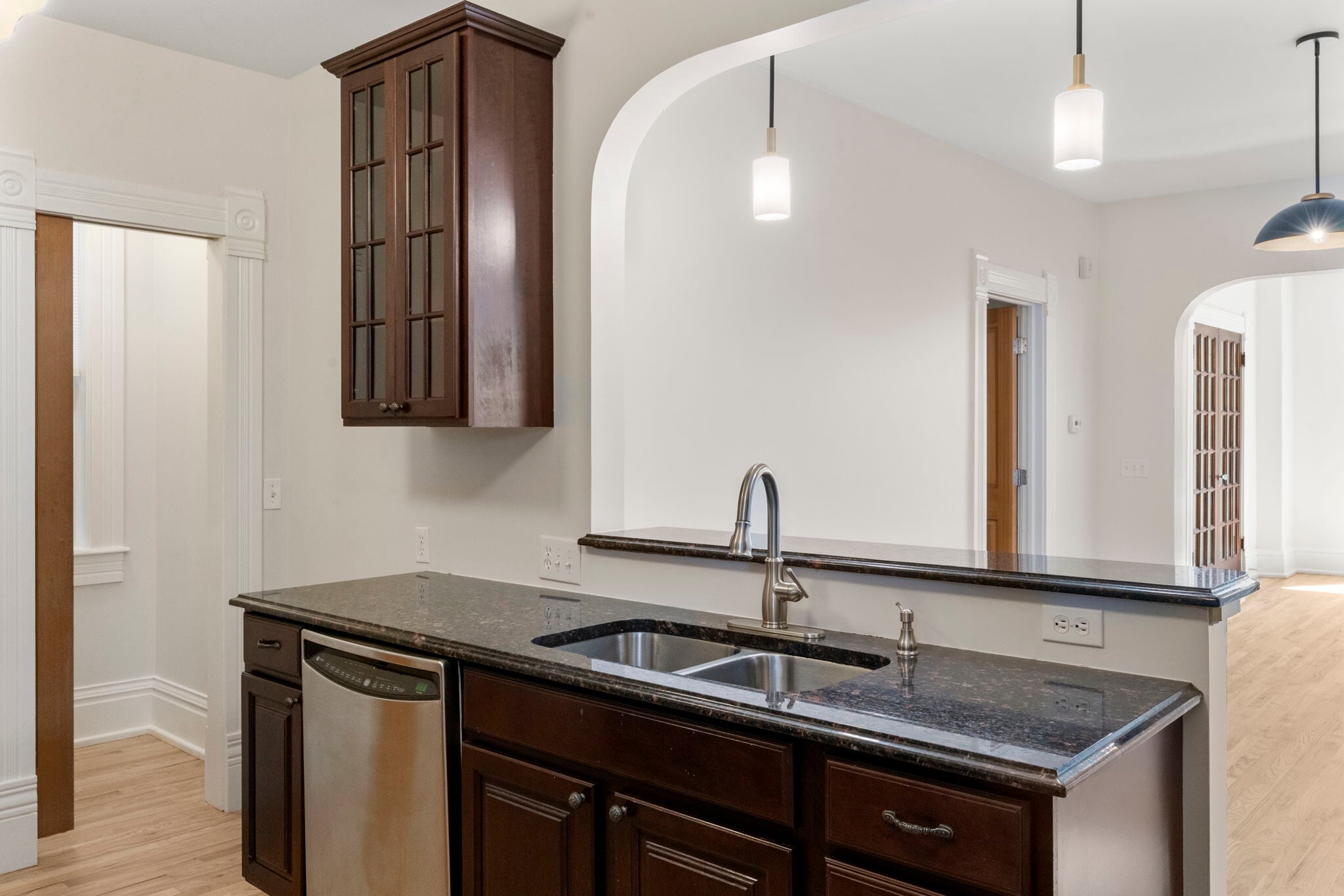 Koitchen view into dining and door to main floor bedroom/office. - 3347 Tejon St