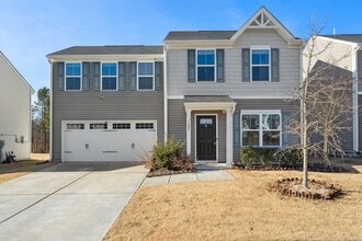 Building Photo - Light and bright 4 bed/ 2,5 bath with fenced back yard and practical glamour!