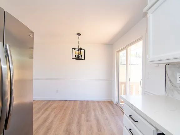 Building Photo - "Charming 5-Bed Sanctuary with Cozy Fireplace on South Rogers Street!"