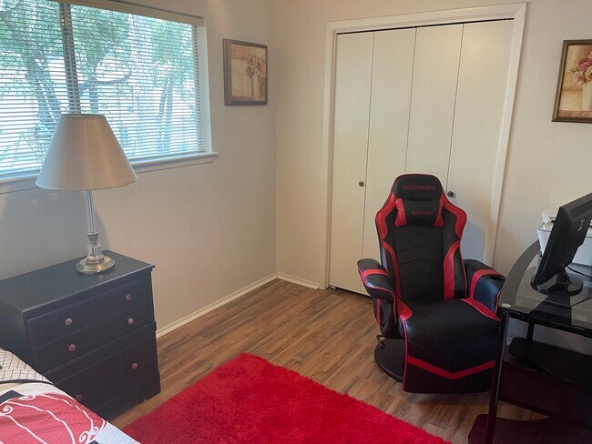 Hardwood floors and gaming chair in 4th bedroom - 2931 Valley Rose Dr