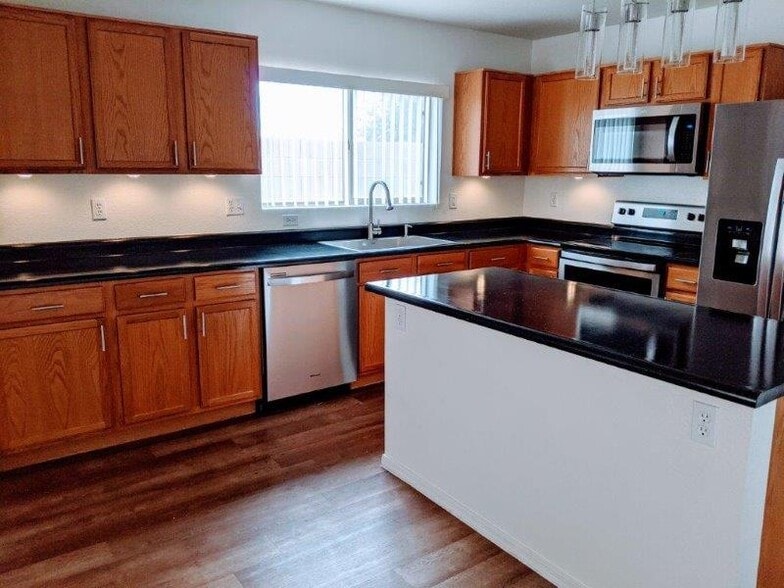 Kitchen has brand new matching stainless steel appliances with separate pantry - 11547 N 153rd Dr