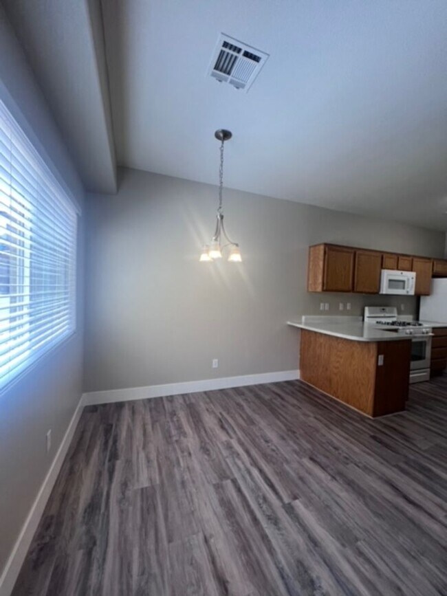 Building Photo - Three bedroom townhouse with 2 car garage