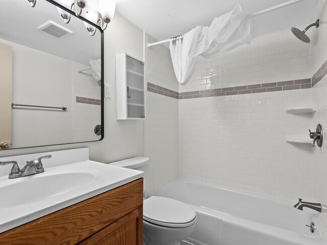 Building Photo - Commuter’s Dream! Large 2BR/2BA Condo Steps from Metro – All Utilities Included!