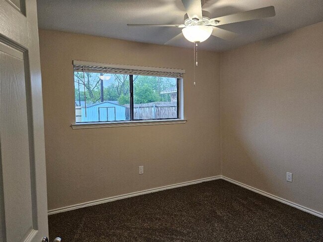 Building Photo - Three bedroom and two bathroom nicely remodeled with new flooring. Large wood fenced backyard