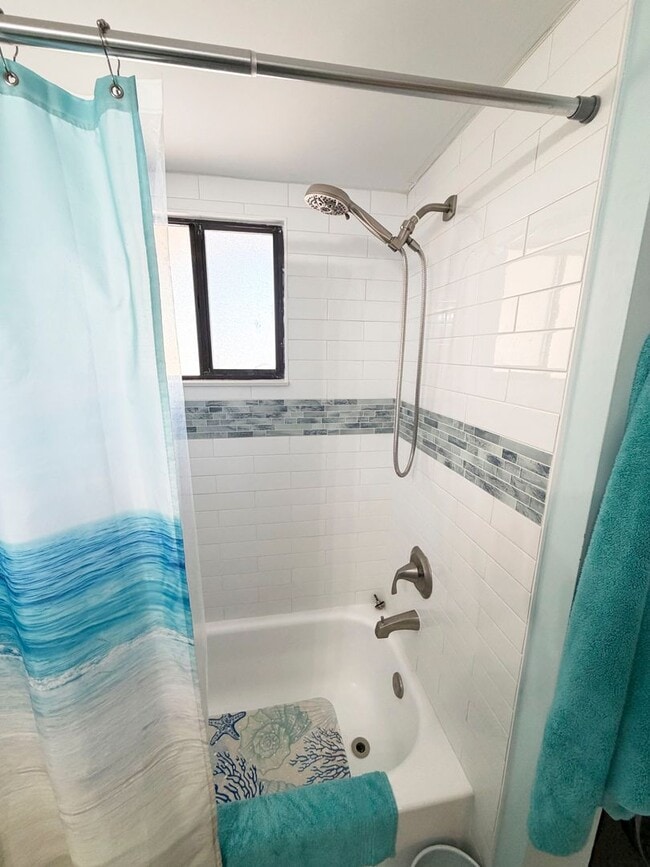 Building Photo - Beautifully Renovated, Fully Furnished Beach Condo just a short walk from the ocean.