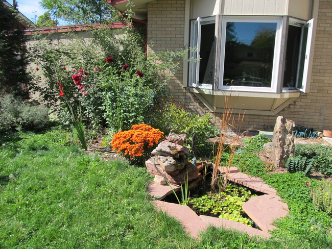 Bay window overlooking water feature and flower gardens. - 28 James Circle