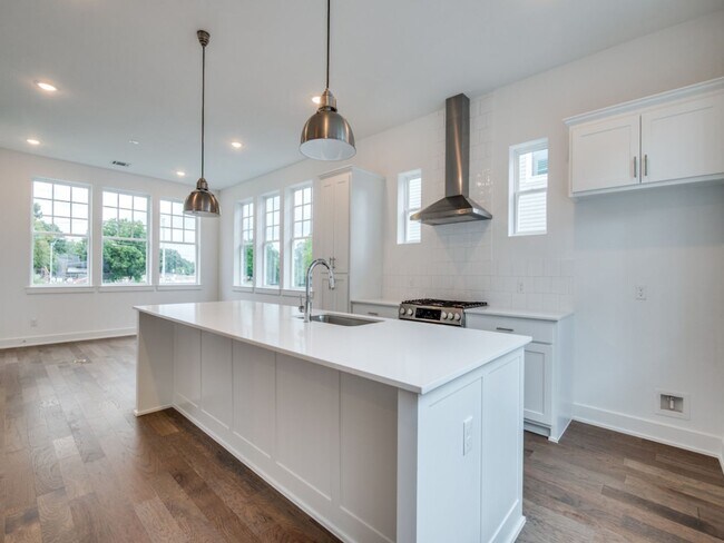 Building Photo - Welcome to a beautiful Craftsman-style end...