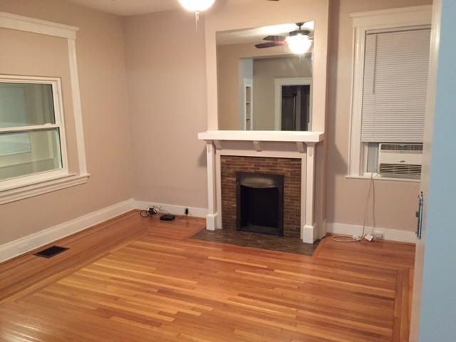 Natural hardwood floors and the non active fireplace mantle. Room ready for cable and wifi router set up. - 4501 Walter Ave