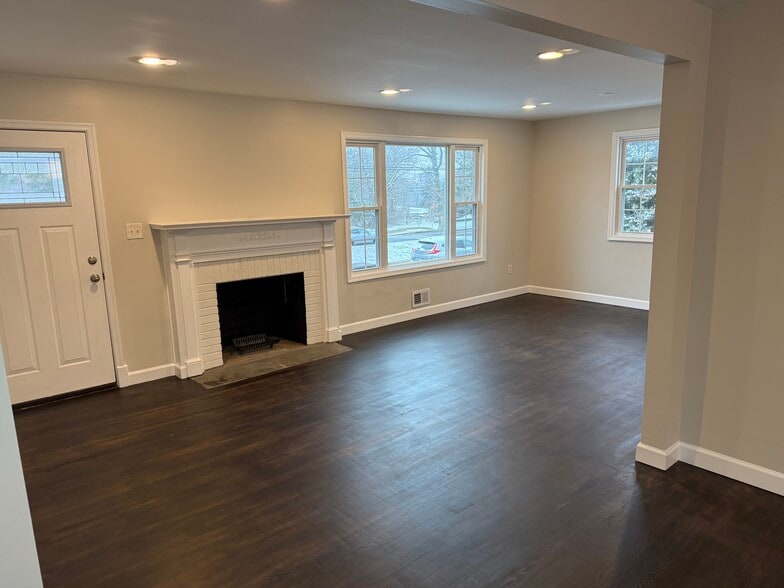 Front door & fireplace from dining room - 4915 Strathmore Ave