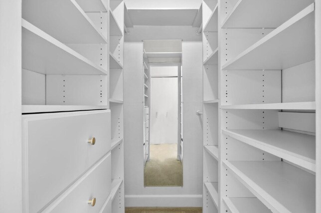 Custom walk-in closet with hanging, shelving and drawers. - 2221 Ocean Ave