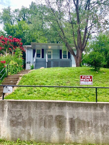 Here is a view from the sidewalk. This is where you would park your car to access the front exit. - 1332 Buena Vista Blvd SE