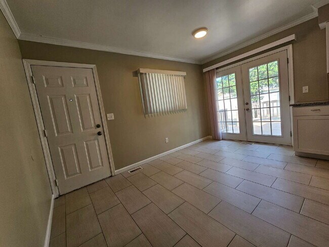Building Photo - Clean 3-Bedroom Tri-Level, 1.5 Bath with Updated Kitchen, Great Room, Fireplace & Private Backyar...