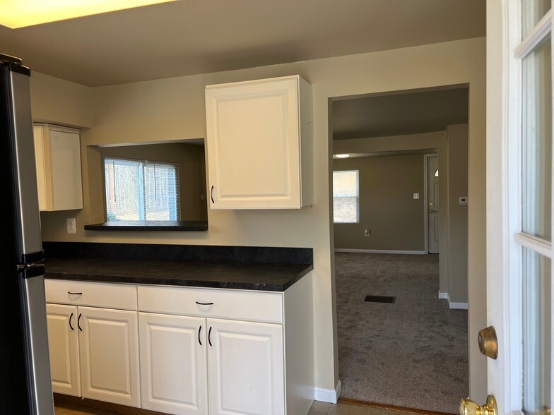 kitchen looking into dining/living space - 404 Schucks Rd