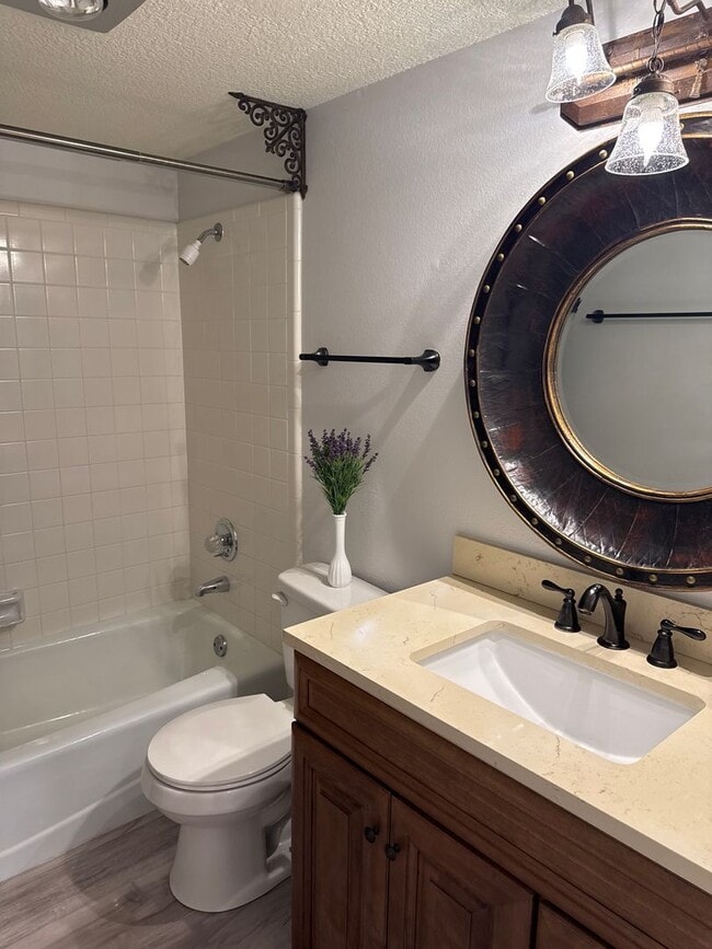 Building Photo - Two-story, four-bedroom, three-bathroom ho...