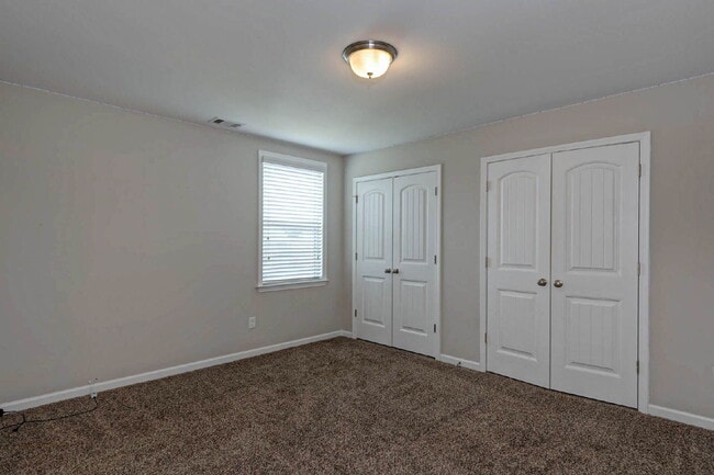 Building Photo - 4BR/3.5BA · 2,809 SF · Owner's Suite on Main · Fenced Yard · Midland, GA — $2,800/mo