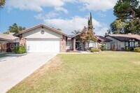 Building Photo - 4 Bedroom/2 Bath Home with a Pool and Sola...